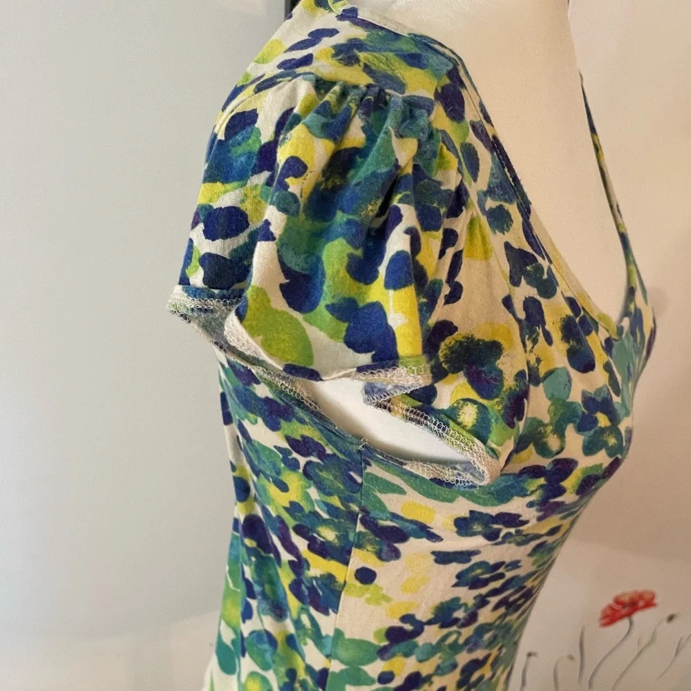 Cream shirt with blues and greens that resemble leaves on a cap sleeve shirt - Picture 5 of 8